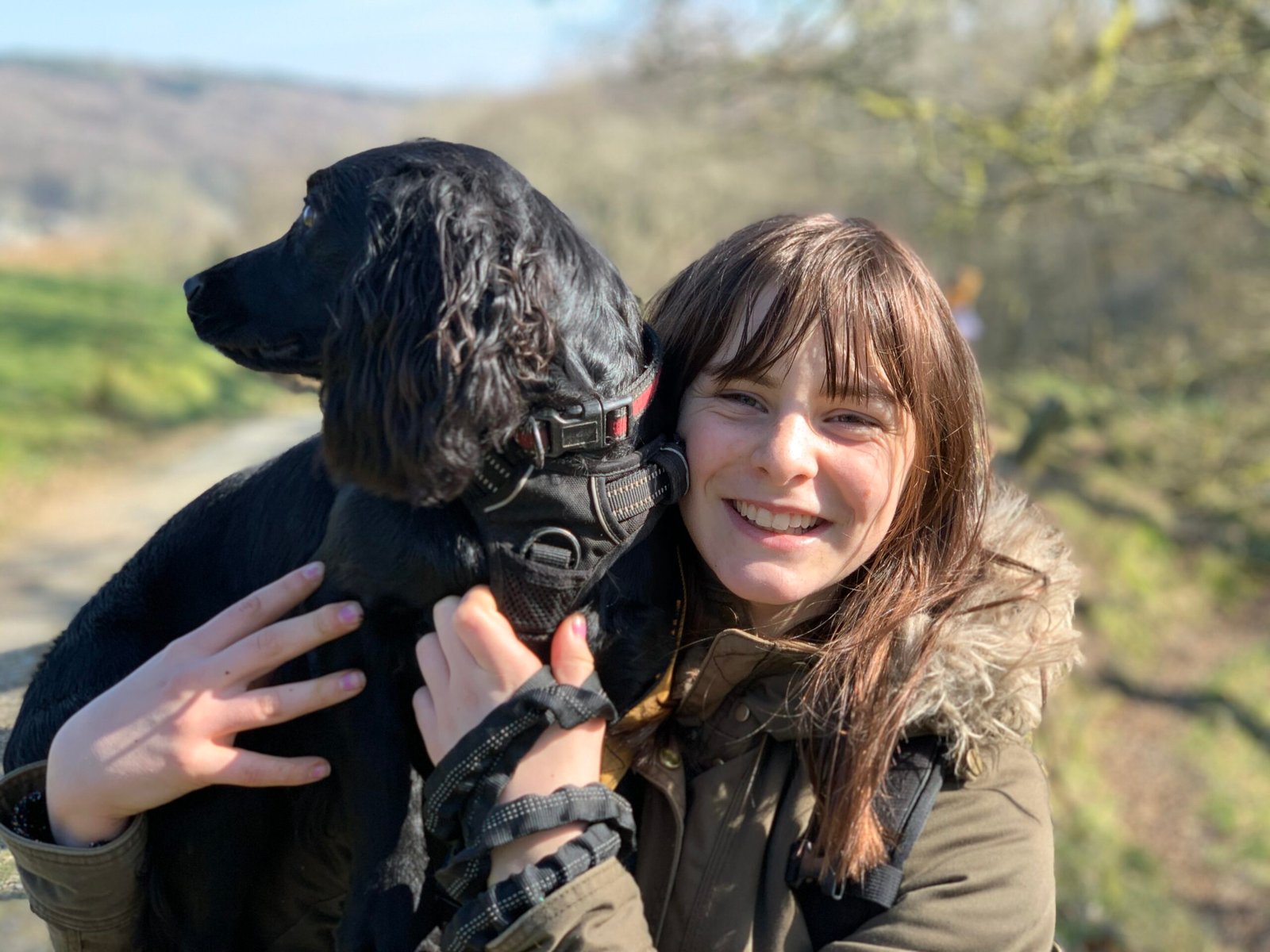 Alice, the owner of Muddy Paws, with her dog outdoors